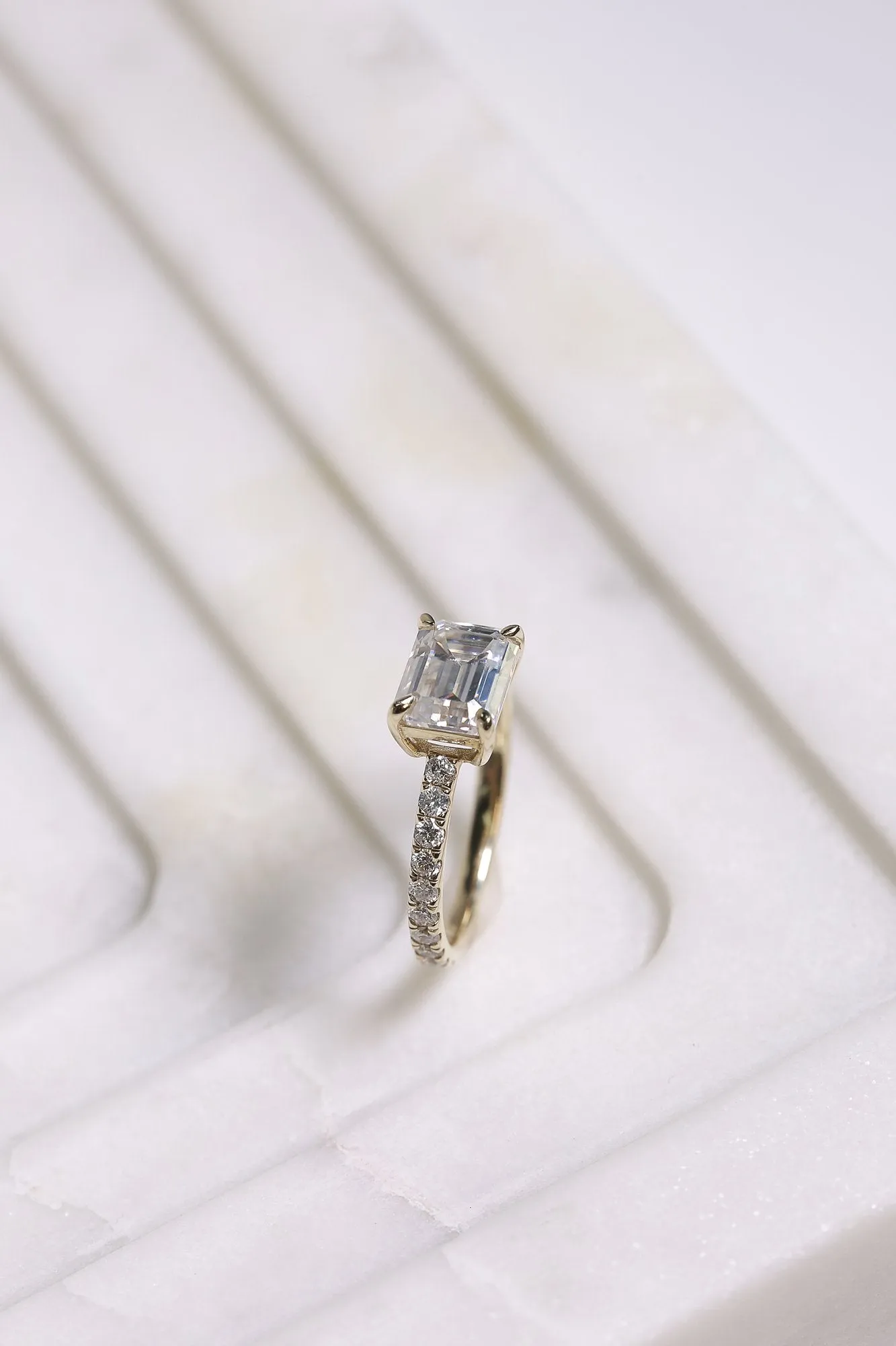 East-West Style Emerald Moissanite Engagement Ring