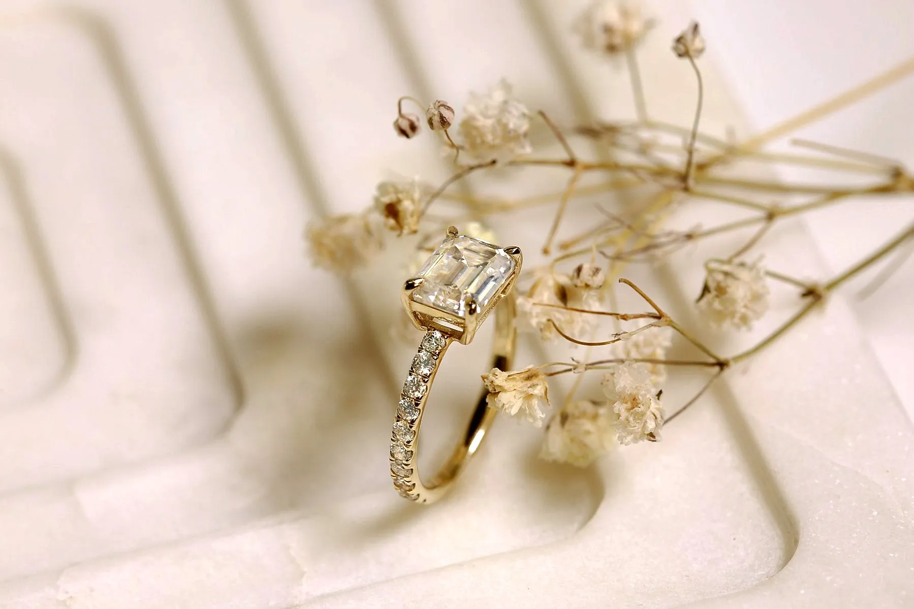 East-West Style Emerald Moissanite Engagement Ring